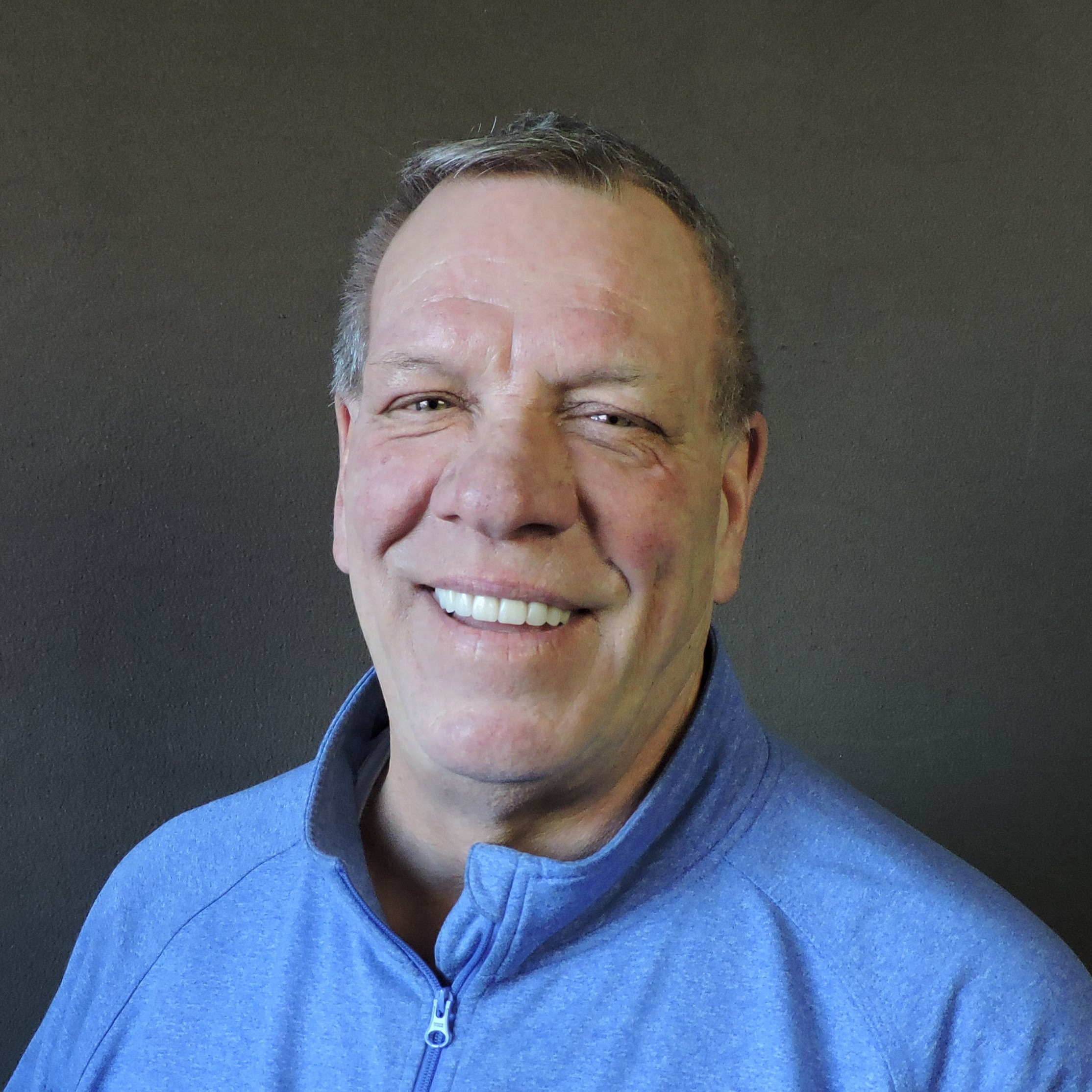 Joe Block smiling in blue Runnion shirt